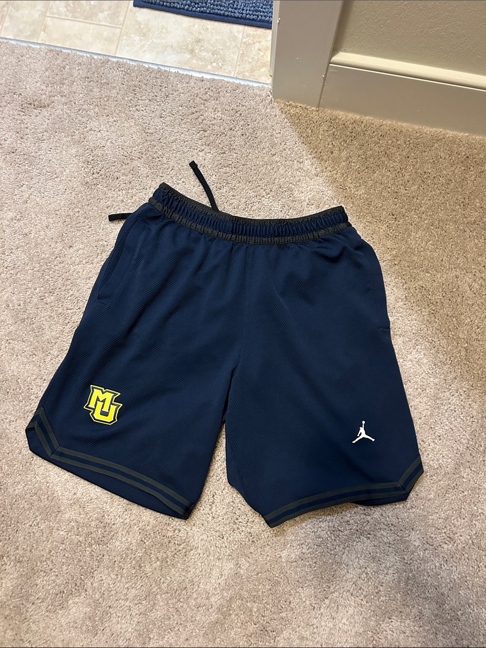 player exclusivity Jordan Navy Shorts with Yellow Marquette Logo